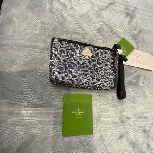 Kate Spade Small wristlet NWT with black and silver sequences